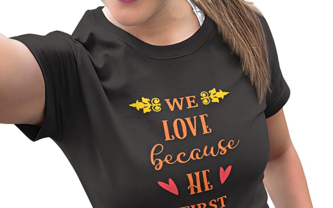 We-love-because-He-first-loved-us-female-model-black-t-shirt-orange-text_new