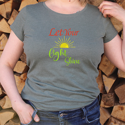 a grey embroidery t-shirt with a yellow sun and and words written let your light shine.