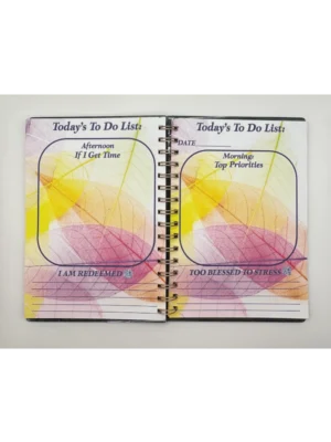 a spiral bound notebook with a colorful design