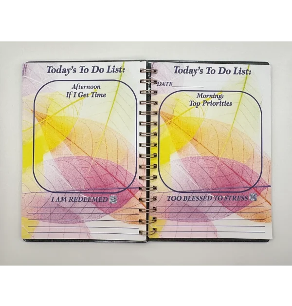 a spiral bound notebook with a colorful design