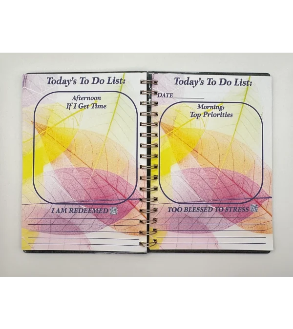 a spiral bound notebook with a colorful design